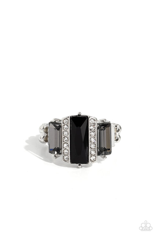 A Glitzy Verdict - Black and Silver Ring - Paparazzi Accessories - Bordered by two rows of dainty white rhinestones, an emerald cut black rhinestone adorns the center of a band dotted with a pair of smoky emerald cut rhinestones, resulting into a jaw-dropping dazzle across the finger. Features a stretchy band for a flexible fit. Sold as one individual ring.