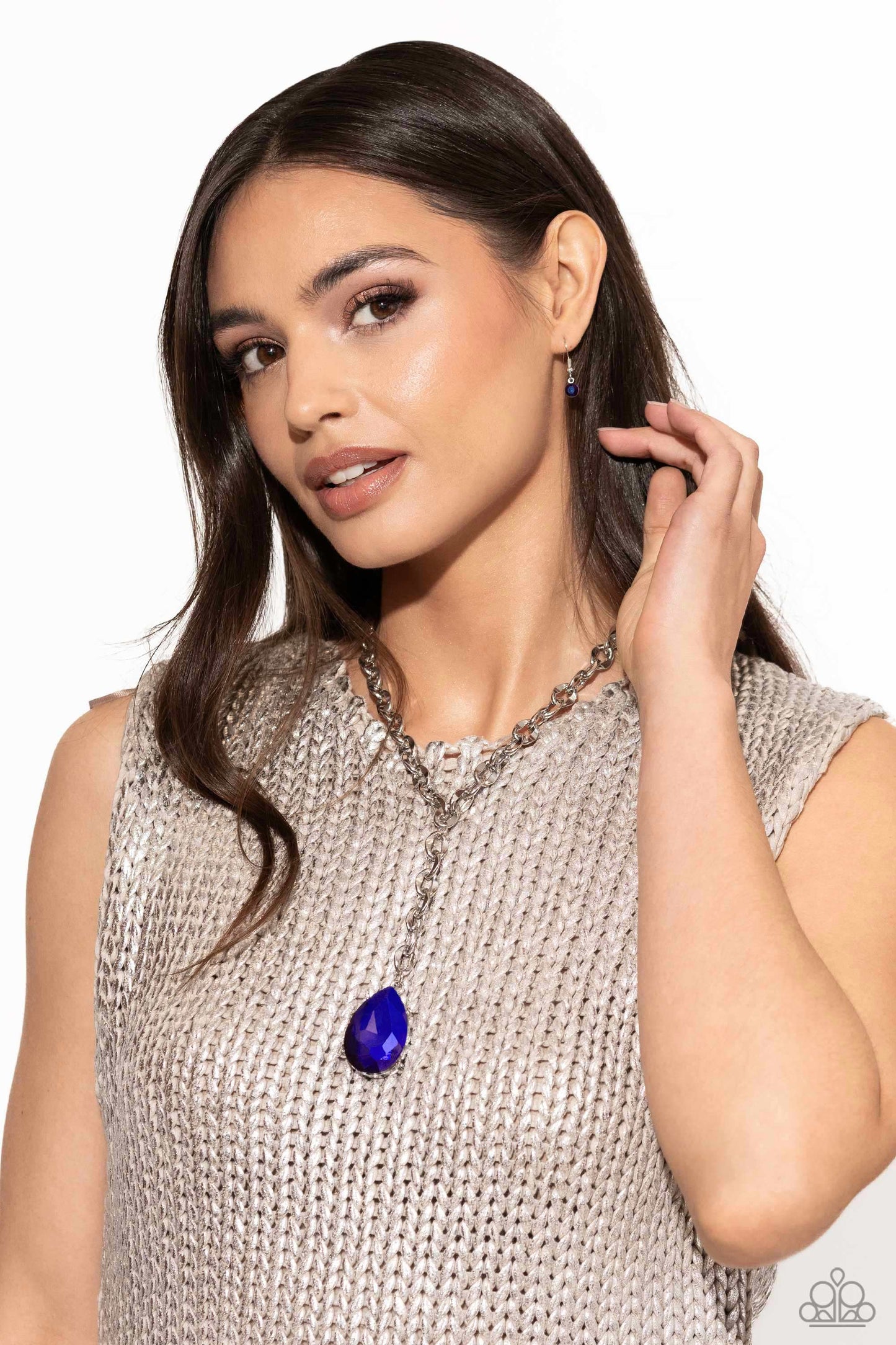 Benevolent Bling - Purple Gem Necklace - Paparazzi Accessories - Set in an elevated silver-pronged frame, a faceted purple UV teardrop gem cascades from an oblong, abstract silver ring chain that extends past the collar for a blinding statement.