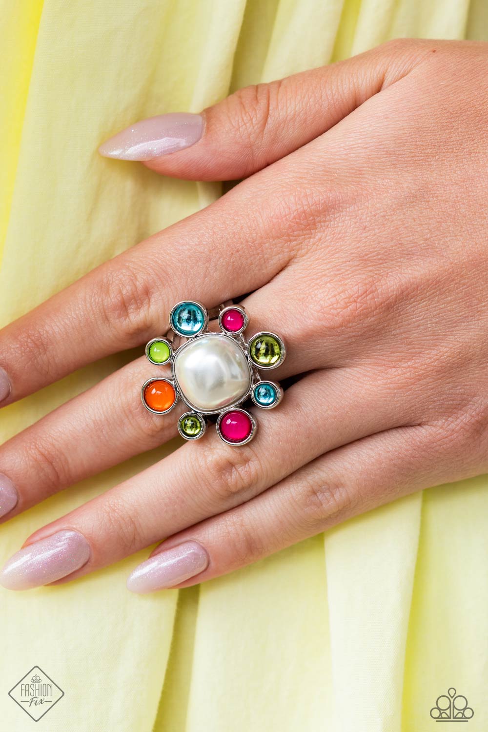 Candescent Collector - Multi Color Ring - Paparazzi Accessories - Pressed into a high-sheen silver frame, glassy and milky olive, Pink Peacock, turquoise, orange, and Kohlrabi petals encircle an abstract pearly center, creating an ethereal flower centerpiece atop the finger. Features a stretchy band for a flexible fit. Sold as one individual ring.
