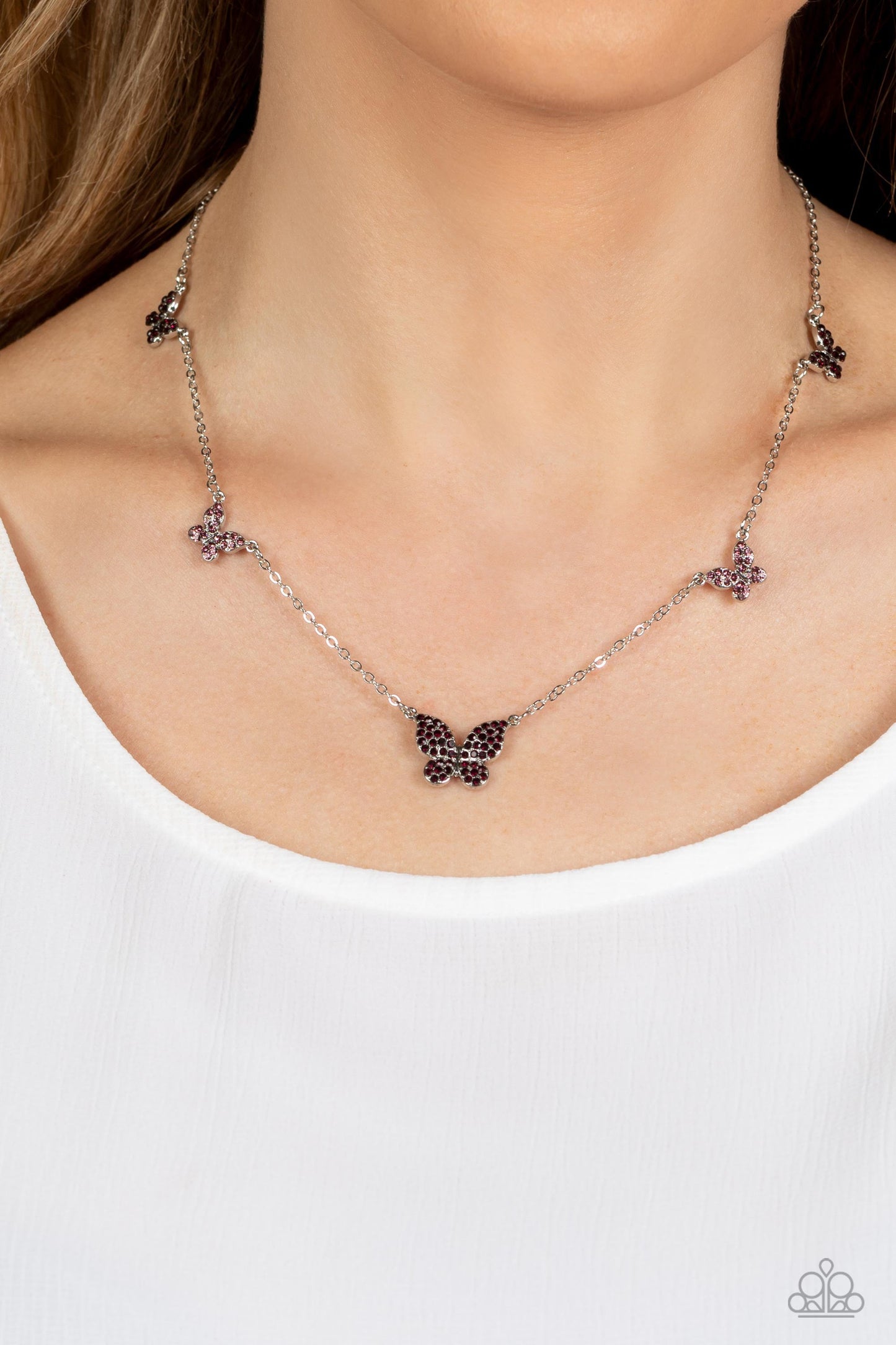 FAIRY Special - Purple Butterfly Necklace - Paparazzi Accessories - Floating along a dainty silver chain, a collection of silver butterflies in varying sizes coalesces around the neckline for a whimsical finish. Each butterfly features a monochromatic shimmer of amethyst and light amethyst rhinestones for a sparkly statement.