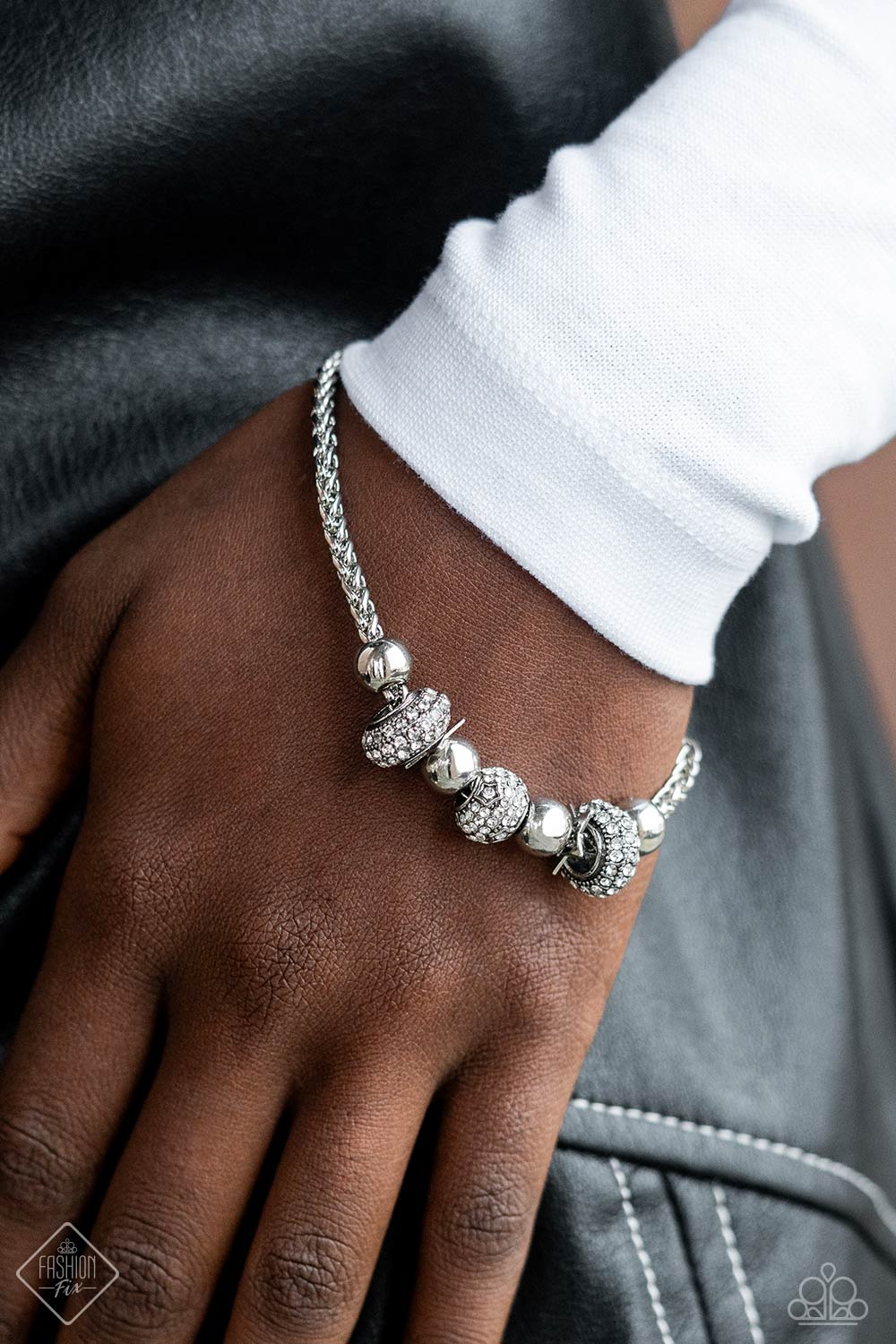 Magnificent Musings - Silver Jewelry Set - Paparazzi Accessories - Round and cylindrical shimmery silver beads, infused with sparkling white rhinestones, slide along a thick silver chain, while glistening silver star silhouettes - also embossed on the rhinestone-encrusted beads in a daintier size - create a star-struck finish around the wrist. Features an adjustable clasp closure.