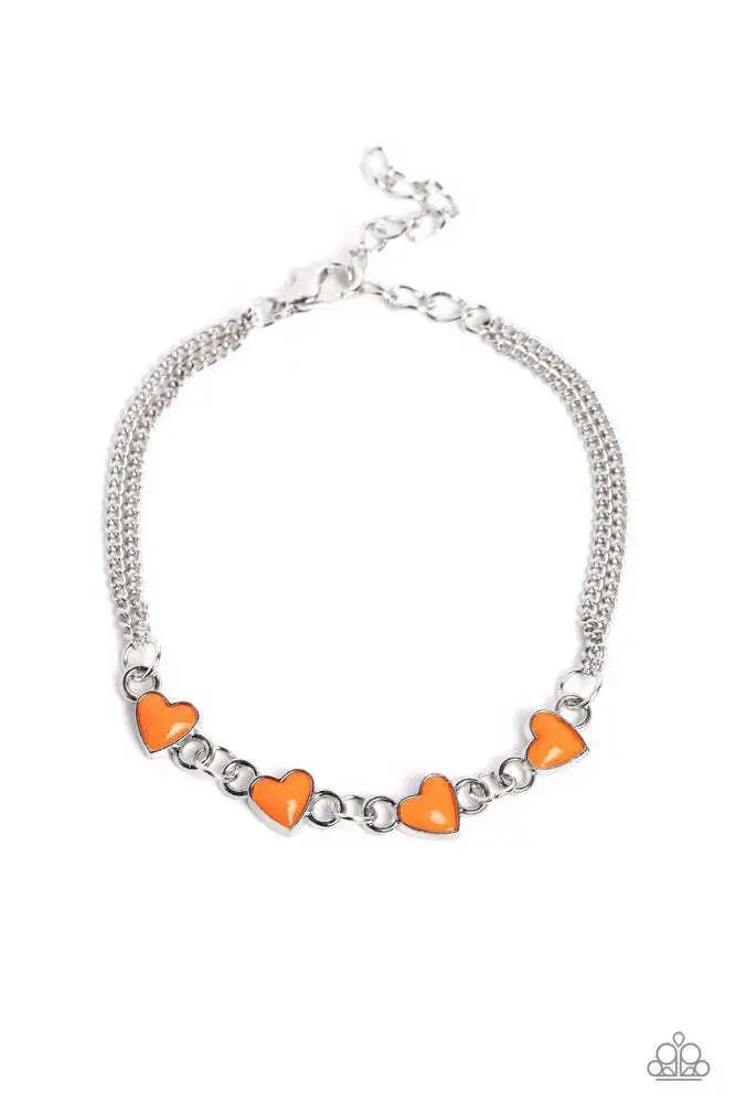 Smitten Sweethearts - Orange Bracelet - Paparazzi Accessories - Nestled in dainty silver frames, a quad of vibrant orange heart-shaped pendants delicately links across the wrist on a double strand of silver chains for a dash of swoon-worthy color.