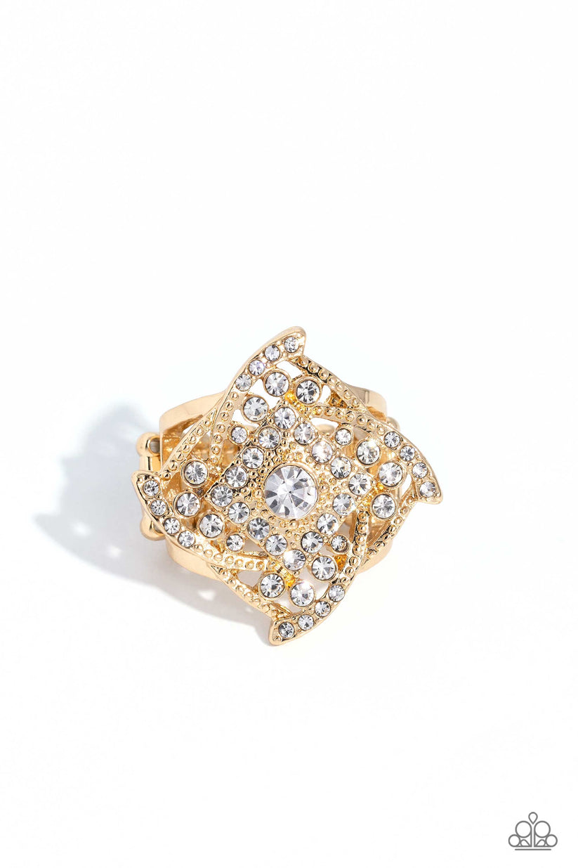 Tilted Talent - Gold Fashion Ring - Paparazzi Accessories - A tilted, gold square-cut frame embossed with golden studs and white gems is framed by whirling ribbons of gold, equally encrusted in gold studs and white gems. As it sits atop a pair of airy gold bands, the high-sheen centerpiece catches and reflects the light of the accents that surround it, magnifying its impressive impact. Features a stretchy band for a flexible fit.