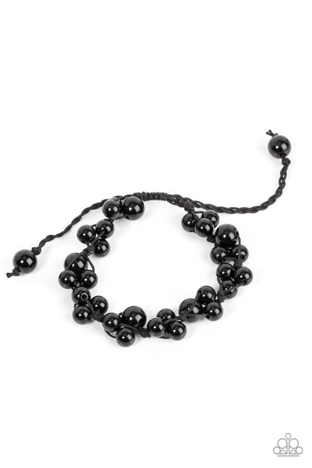 Vintage Versatility - Black Bracelet - Paparazzi Accessories - Bubbly clusters of black beads are decoratively knotted around the wrist, adding a timeless twist to the classic centerpiece.