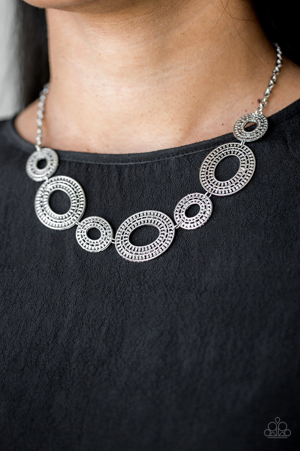 Basically Baltic - Silver Necklace - Paparazzi Accessories - Radiating with circular details, airy oval frames link below the collar for a casual look. Features an adjustable clasp closure. Sold as one individual necklace. Includes one pair of matching earrings.