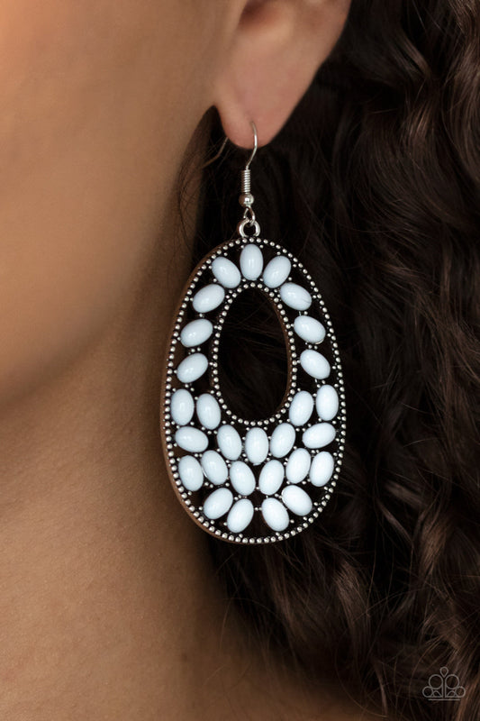 Beaded Shores - White and Silver Earrings - Paparazzi Accessories - A collection of oval white beads collect inside a studded silver oval frame, creating a bright pop of color. Earring attaches to a standard fishhook fitting. Sold as one pair of earrings.