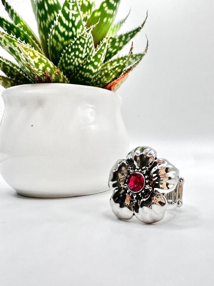 Bloom Bloom Pow - Pink Floral - Silver Ring - Paparazzi Accessories - Dotted with dainty silver studs and a dainty fuchsia rhinestone center, folds of shiny silver curl into an oversized tropical flower for a whimsical dash of island inspiration atop the finger.