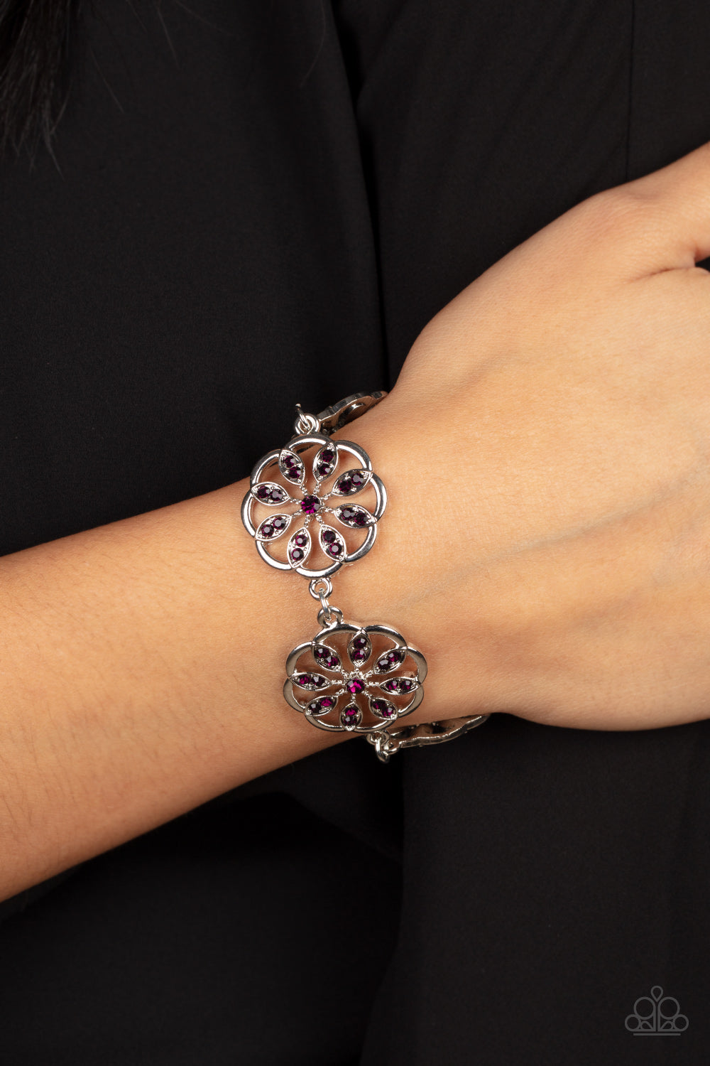 Blooming Bling - Purple Floral - Silver Bracelet - Paparazzi Accessories -
Adorned with purple rhinestone floral accents, scalloped silver frames delicately link around the wrist for a sparkly seasonal fashion. Features an adjustable clasp closure. Sold as one individual bracelet.