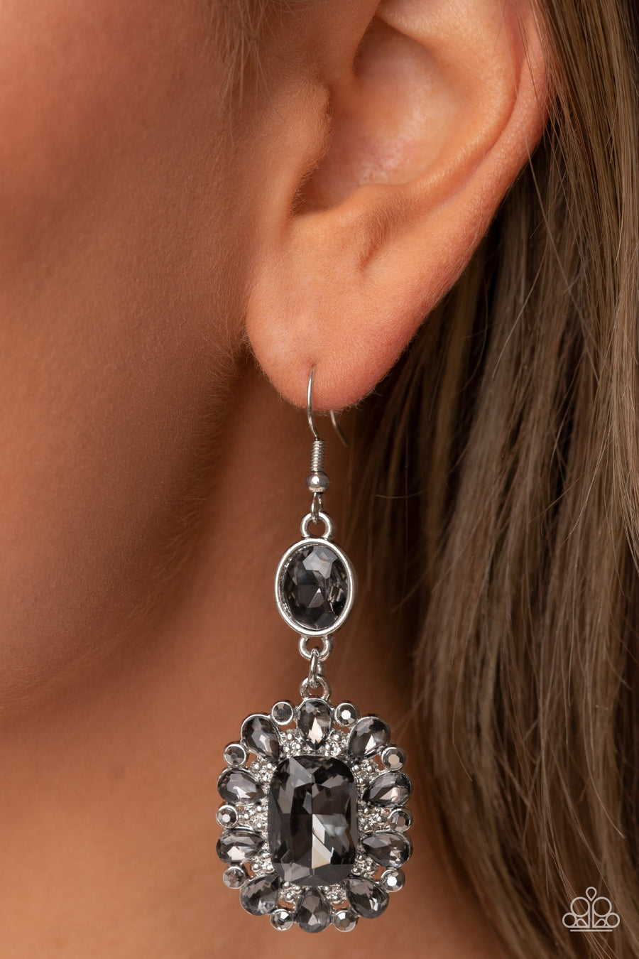 Capriciously Cosmopolitan - Silver Gem Earrings - Paparazzi Accessories - Dainty hematite rhinestones and teardrop smoky gems fan out from an oversized smoky emerald cut gem at the bottom of a solitaire oval smoky gem, resulting in a glamorously glitzy lure. Earring attaches to a standard fishhook fitting.