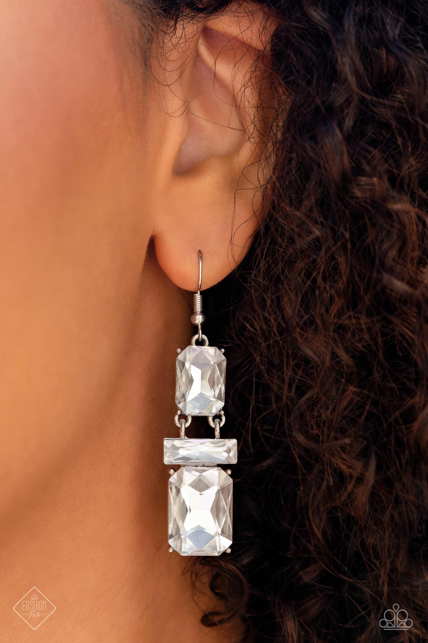 CHAIN Check - White and Silver Earrings - Paparazzi Accessories - Two oversized emerald-cut gems sparkle unapologetically, increasing in size as they fall from the ear. A white gem bar, featuring sharp faceted surfaces, lays perpendicular to the blinding emerald-cut gems, separating the two and emphasizing their hinged movement.