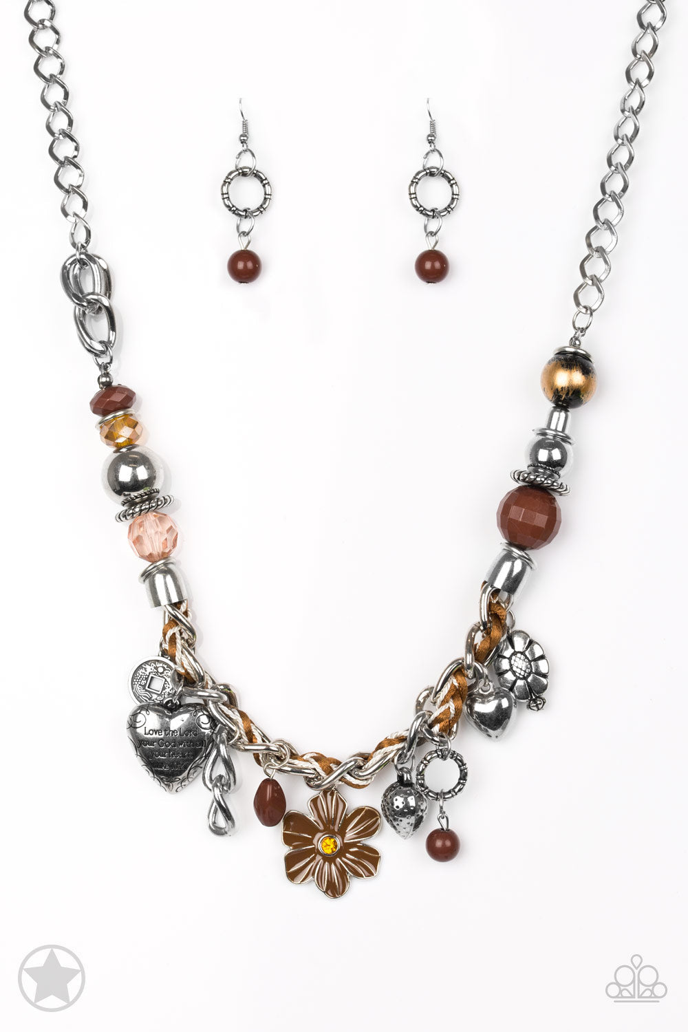 Charmed, I Am Sure - Brown and Silver Necklace - Paparazzi Accessories - Brown and ivory cording is braided through a chunky silver chain. A unique variety of charms decorate the piece including a delicate flower and a heart inscribed with the phrase "With All My Heart" on one side and a short bible verse on the other that reads, "Love the Lord thy God with all your heart. Luke 10:27" Features an adjustable clasp closure.