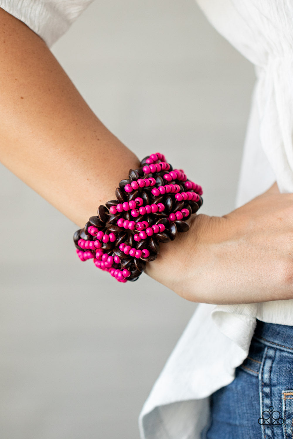 Cozy in Cozumel - Pink and Brown Wood Bracelet - Paparazzi Accessories - A collection of dainty pink wooden beads and brown wooden discs are threaded along knotted stretchy bands, creating a tropical floral pattern around the wrist. Sold as one individual bracelet.