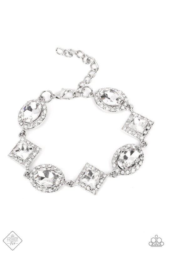 Decade of Dazzle - Silver and White Bracelet - Paparazzi Accessories - Dramatic white rhinestones, in both oval and square cuts, wrap around the wrist in an alternating pattern. Each faceted gem is wrapped in tiny white rhinestones, emphasizing their sparkle, with the square-cut gems tilted on a point to intensify their glitz. Features an adjustable clasp closure. Sold as one individual bracelet.