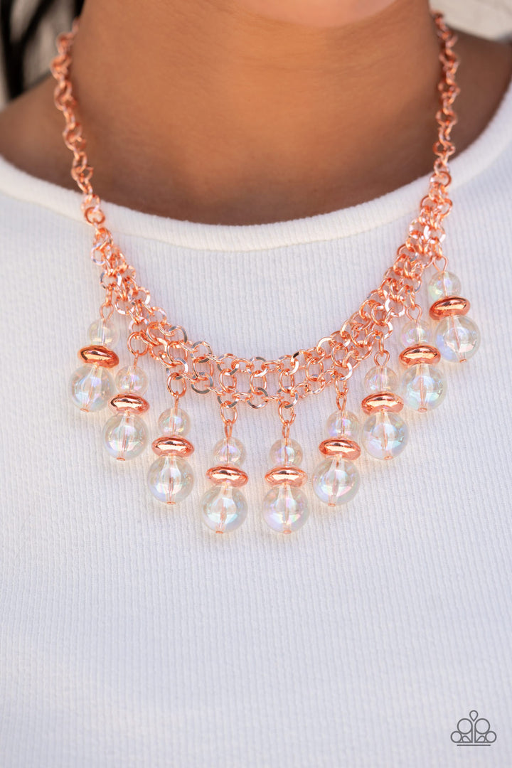 Deep Space Diva - Copper Necklace - Paparazzi Accessories - Featuring a stellar iridescence, pairs of glassy beads are separated by shiny copper discs, trickling below the collar in an effervescent fringe. Features an adjustable clasp closure.