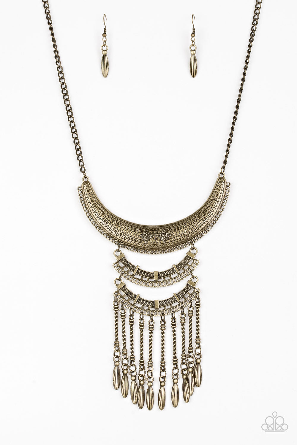 Eastern Empress - Brass Necklace - Paparazzi Accessories - Stamped and embossed in tribal inspired patterns, three brass plates connect down the chest, creating a fiercely stacked pendant. Attached to twisted brass rods, ornate brass beads swing from the bottom of the lowermost plate, creating an eye-catching fringe.