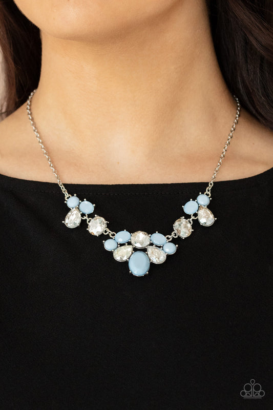 Ethereal Romance - Blue Beads - Rhinestones - Silver Necklace - Paparazzi Accessories - 
Varying in opacity and shape, mismatched Cerulean beads attach to oversized white rhinestones, creating bubbly frames that delicately link into an ethereal display below the collar. Features an adjustable clasp closure.