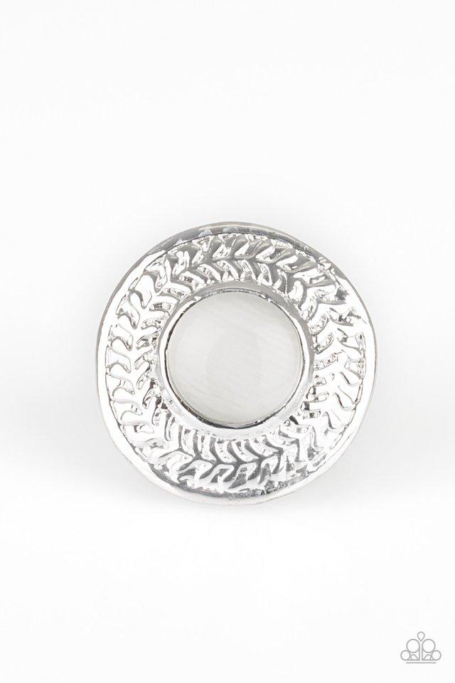 Garden Garland - White Moonstone Ring - Paparazzi Accessories -
A glowing white moonstone is pressed into a large silver frame embossed in a leafy pattern for a whimsical look. Features a stretchy band for a flexible fit.