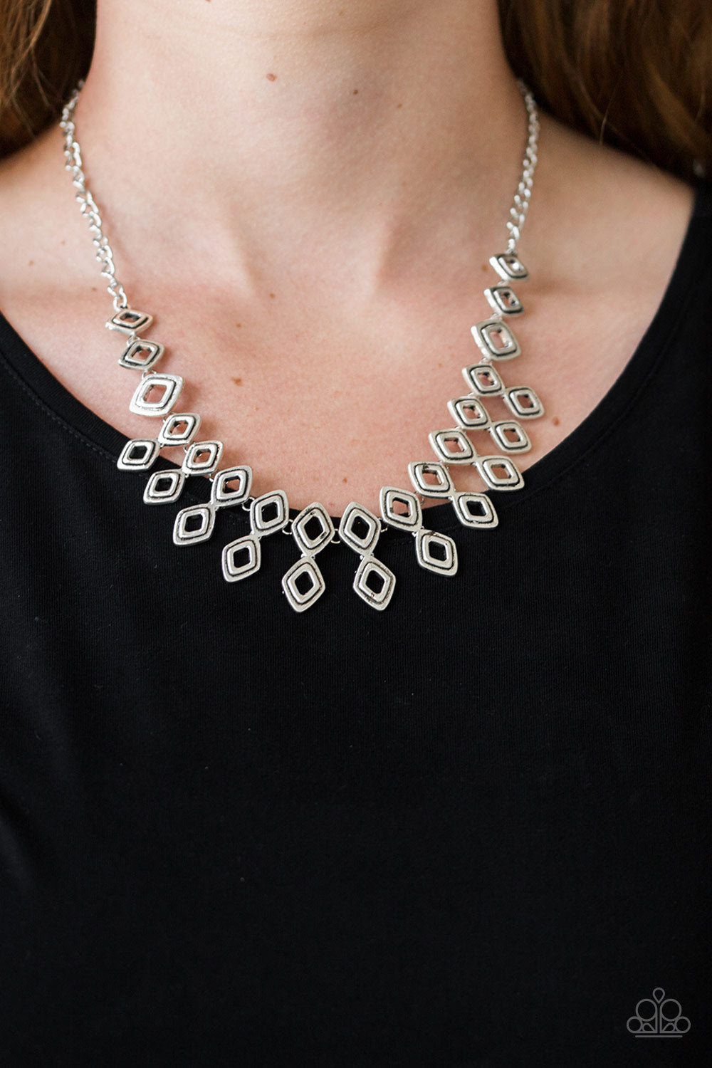 Geocentric - Silver Fashion Necklace - Paparazzi Accessories - Brushed in an antiqued shimmer, glistening diamond-shaped silver frames link below the collar, coalescing into an edgy geometric fringe. Features an adjustable clasp closure. Sold as one individual necklace.