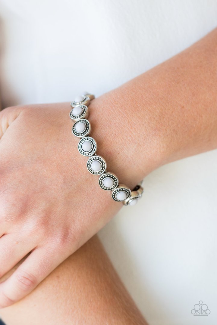 Globetrotter Goals - Gray - Silver Stretchy Bracelet - Paparazzi Accessories - Dotted with neutral gray beaded centers, studded silver frames are threaded along stretchy elastic bands and linked around the wrist for a whimsical look. Sold as one individual bracelet.