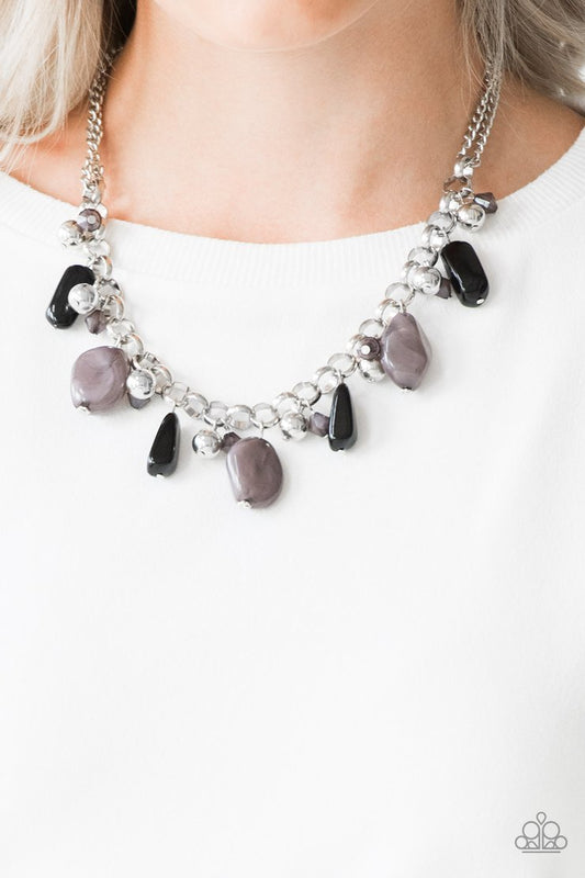 Grand Canyon Grotto - Black Faux Rock and Silver Necklace - Paparazzi Accessories - 
Featuring polished and cloudy finishes, a collection of black faux rocks dance from the bottom of a bold silver chain. Classic silver beads trickle between the colorful beading, adding a metallic shimmer to the whimsical fringe. Features an adjustable clasp closure.