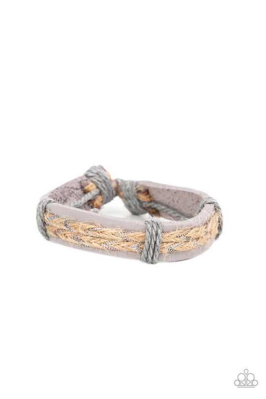 Guided Expedition - Lavender Leather Bracelet - Paparazzi Accessories - Glimmering metallic thread is braided with natural twine and laced to the top of a lavender leather band creating a rustic homespun style around the wrist. Features an adjustable sliding knot closure.