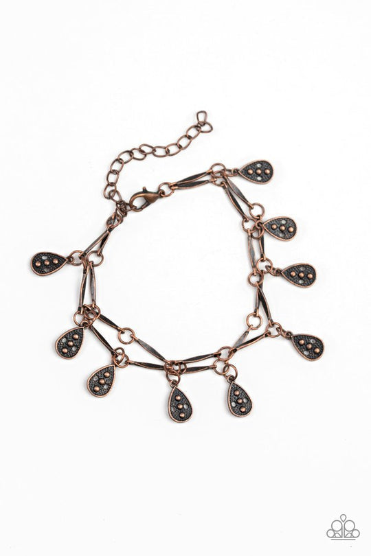 Gypsy Glee - Copper Teardrop - Chain Bracelet - Paparazzi Accessories - Glistening copper rods and ornate teardrops link around the wrist in two rows, creating a playful fringe stylish bracelet. Features an adjustable clasp closure. Bejeweled Accessories By Kristie - Trendy fashion jewelry for everyone -