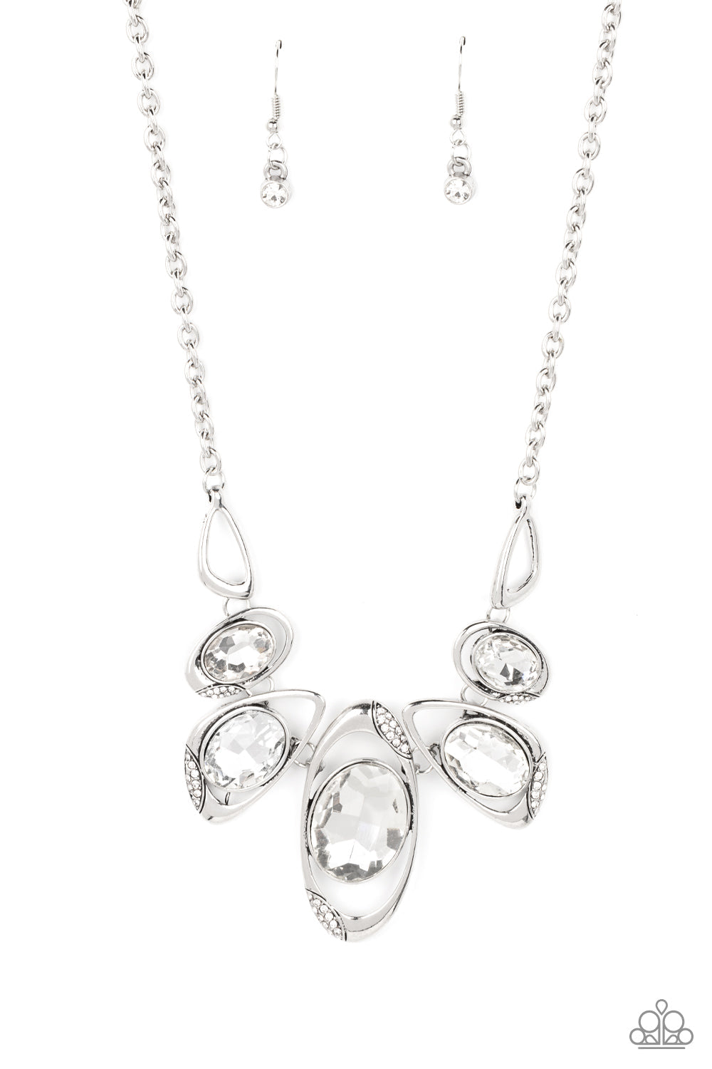 Hypnotic Twinkle - White Gem and Silver Necklace - Paparazzi Accessories - This stunning gem necklace is stunning and great for any occasion or everyday casual wear. It's dusted in sections of glassy white rhinestones, asymmetrical silver frames curl around oversized white gems below the collar. Varying in shape, the mismatched frames increase in size as they near the center for a hypnotizing finish. Bejeweled Accessories By Kristie