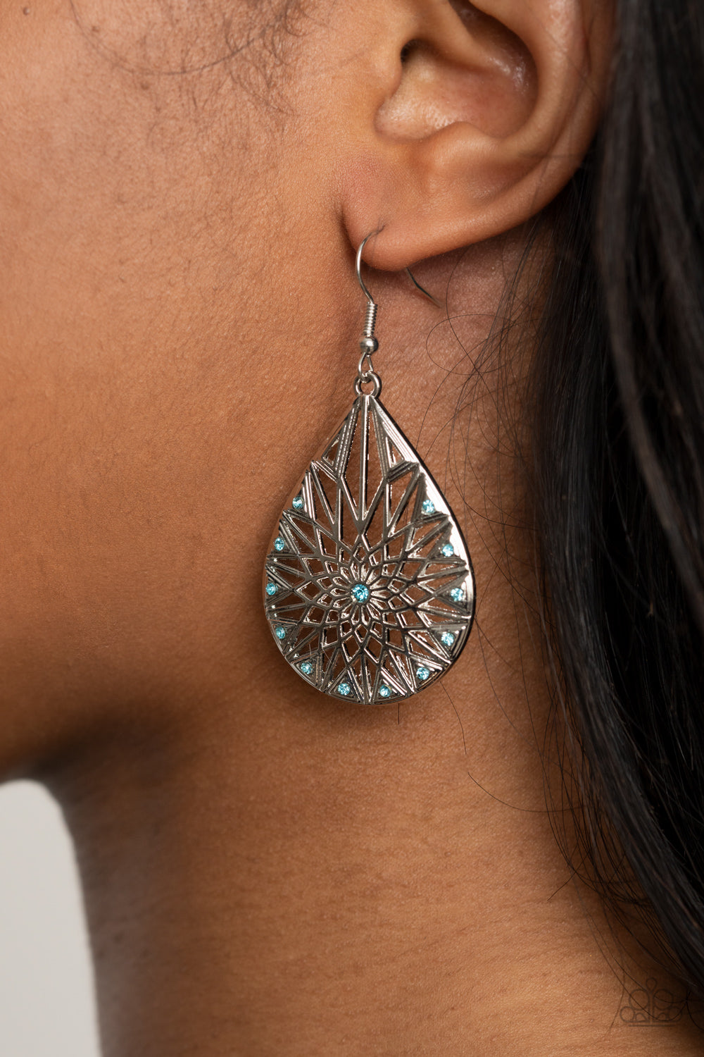Icy Mosaic - Blue and Silver Teardrop Earrings - Paparazzi Accessories - Featuring a shattered snowflake pattern, the front of an airy silver teardrop is adorned in dainty blue rhinestones for an icy finish. Earring attaches to a standard fishhook fitting. Sold as one pair of earrings.