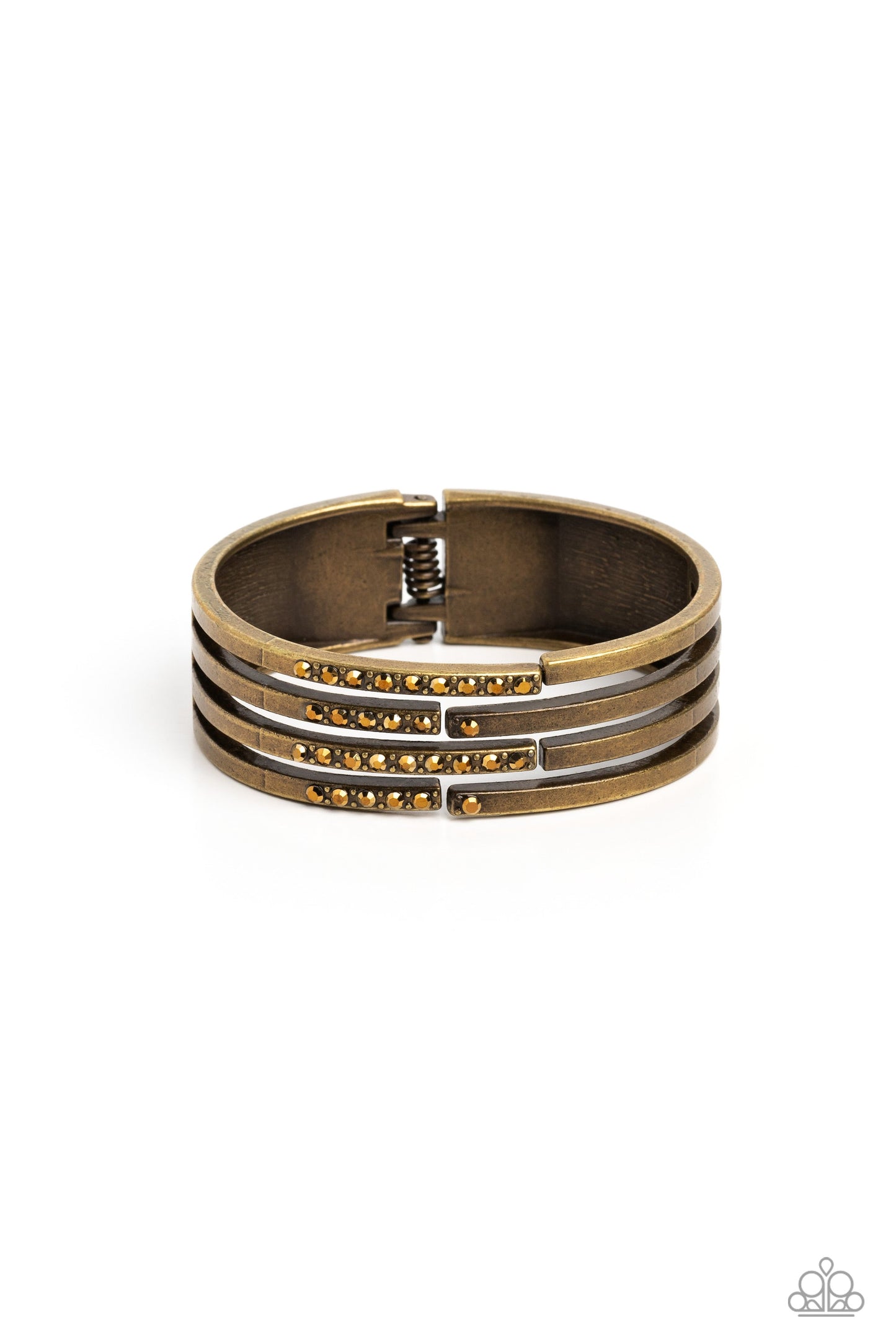 Labyrinth Lure - Brass Bracelet - Paparazzi Accessories - Linear layers of brass stream from a solid piece of brass for an industrial vibe. Featured on the various streams of brass bars, aurum gems and studs coalesce across the surface for a subtle pop of shimmer atop the wrist. The skin peeks out from the scattered bars for additional eye-catching detail. Features a hinged closure.