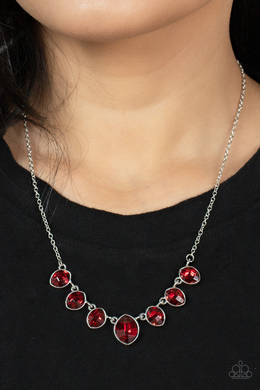 Material Girl Glamour - Red Rhinestone - Silver Necklace - Paparazzi Accessories - Elegant cut fiery red rhinestones delicately connect below the collar. An oversized red rhinestone adorns to the middle of the glittery strand, creating a sparkly centerpiece. Features an adjustable clasp closure.