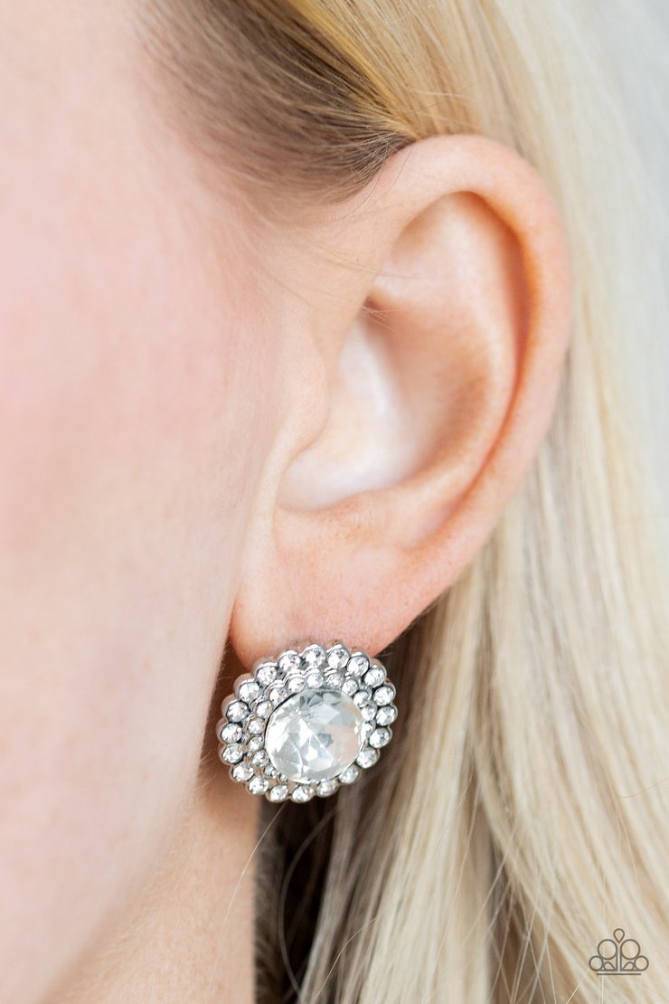 My Second Castle - White Gem and Silver Earrings - Paparazzi Accessories - An oversized white gem is pressed into a shimmery silver frame stacked with glittery white rhinestones for a glamorous touch. Earring attaches to a standard post fitting. Sold as one pair of post earrings.