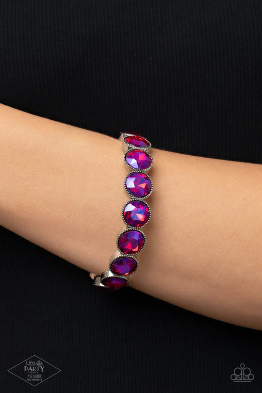 Number One Knockout - Pink Oil Spill Bracelet - Paparazzi Accessories - Featuring a flashy oil spill iridescence, faceted pink gems are pressed into sleek silver frames. The glittery frames are threaded along elastic stretchy bands, creating a glamorous look around the wrist.