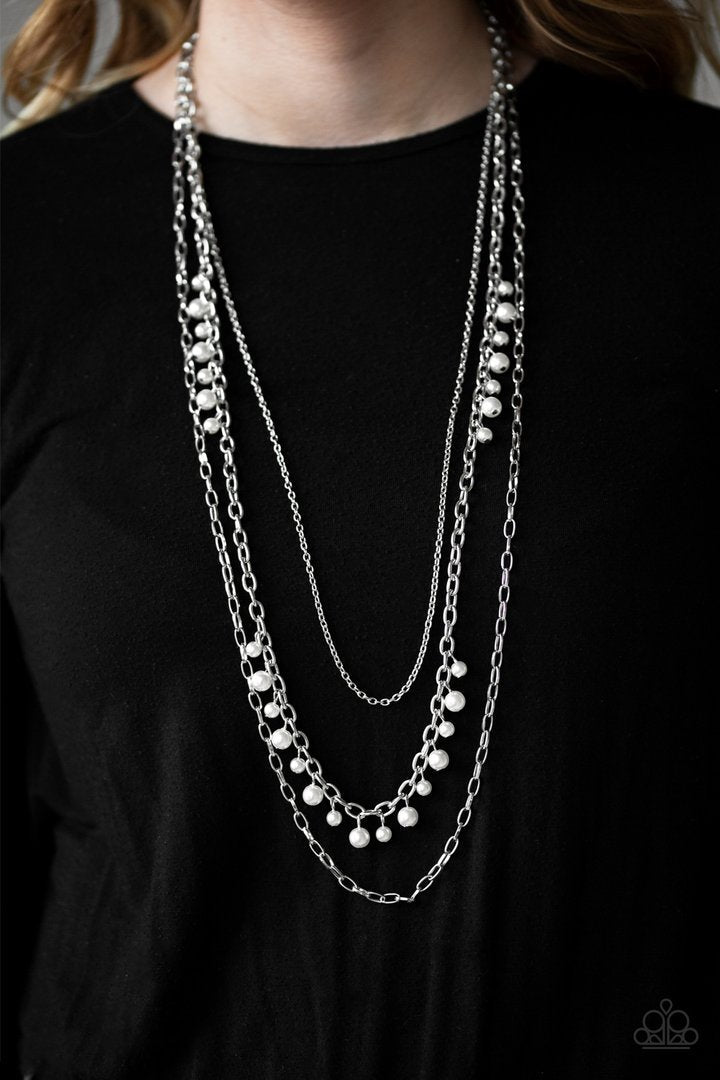 Pearl Pageant - Silver Necklace - Paparazzi Accessories - Three mismatched silver chains layer down the chest. Dainty gray pearls cascade down one silver chain, adding a flirty twist to the timeless pearl palette.