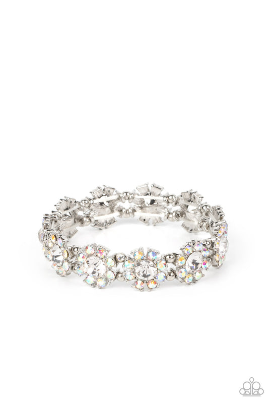 Premium Perennial - Iridescent Multi Bracelet - Paparazzi Jewelry - Bejeweled Accessories By Kristie - Separated by pairs of dainty silver beads, iridescent rhinestone dotted petals bloom from oversized white rhinestone centers along stretchy bands around the wrist for a flirtatious floral fashion. Due to its prismatic palette, color may vary. Sold as one individual bracelet.