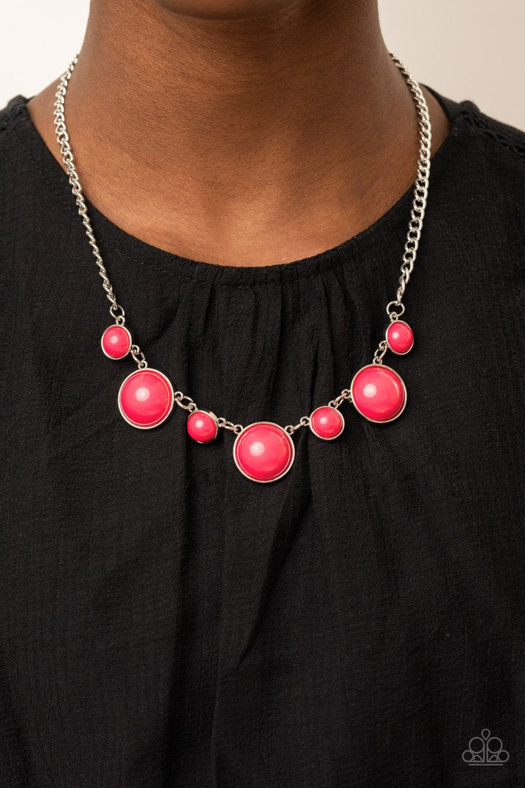 Prismatically POP-tastic Pink and Silver Necklace - Paparazzi Accessories - A bubbly collection of round Raspberry Sorbet beads are pressed into sleek silver fittings as they connect beneath the collar, creating a powerful pop of color. Features an adjustable clasp closure. Sold as one individual necklace.