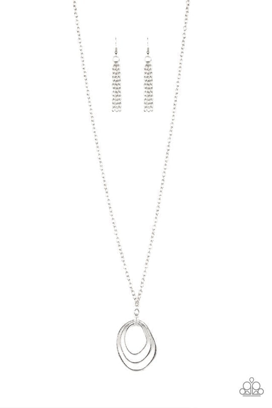 Relic Redux - Silver Fashion Necklace - Paparazzi Accessories - Bejeweled Accessories By Kristie - Asymmetrical silver hoops join into an abstract pendant at the bottom of a lengthened silver chain for an industrial flair.