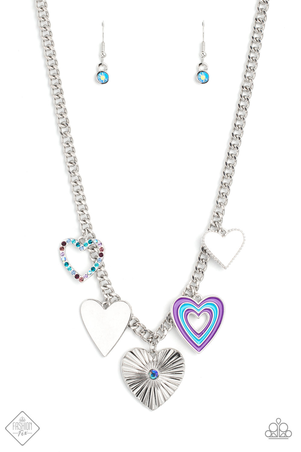 Retro Rhapsody - Blue Purple and Silver Heart Necklace - Paparazzi Accessories - A collection of whimsical heart charms, each with its own unique features, gathers along a flat, silver curb chain. The whimsical charms and intricate details coalesce to create a youthful and vibrant design.