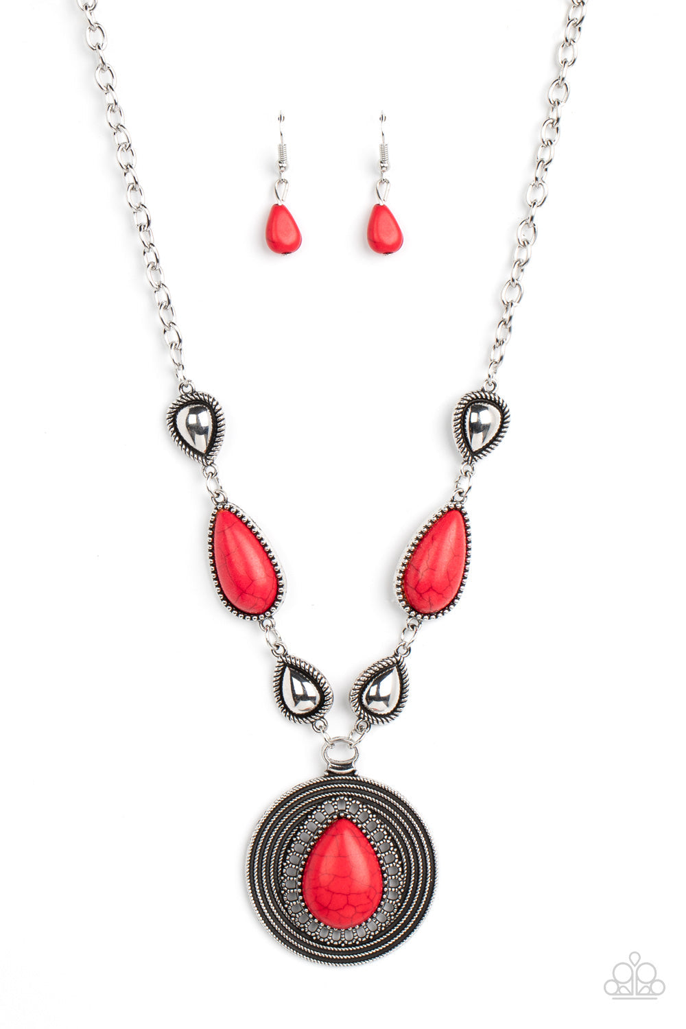 Saguaro Soul Trek - Red Stone and Silver Necklace - Paparazzi Jewelry - shiny silver teardrops alternate with red stone frames at the bottom of a silver chain. Bordered in whirls of studded details, an oversized red teardrop stone is pressed into the center of the rippling silver pendant for a hypnotic finish. Features an adjustable clasp closure.