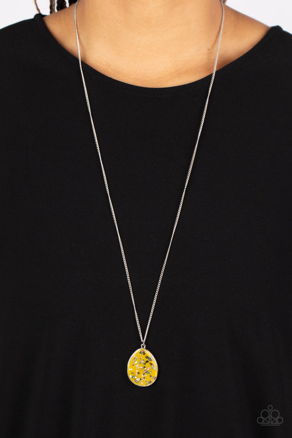 Shimmering Seafloors - Yellow and Silver Necklace - Paparazzi Accessories - Featuring a shell-like iridescence, shimmery flecks are sprinkled along a mustard yellow backdrop inside of a glassy casing. The colorful teardrop swings from the bottom of an extended silver chain, creating a summery pendant.