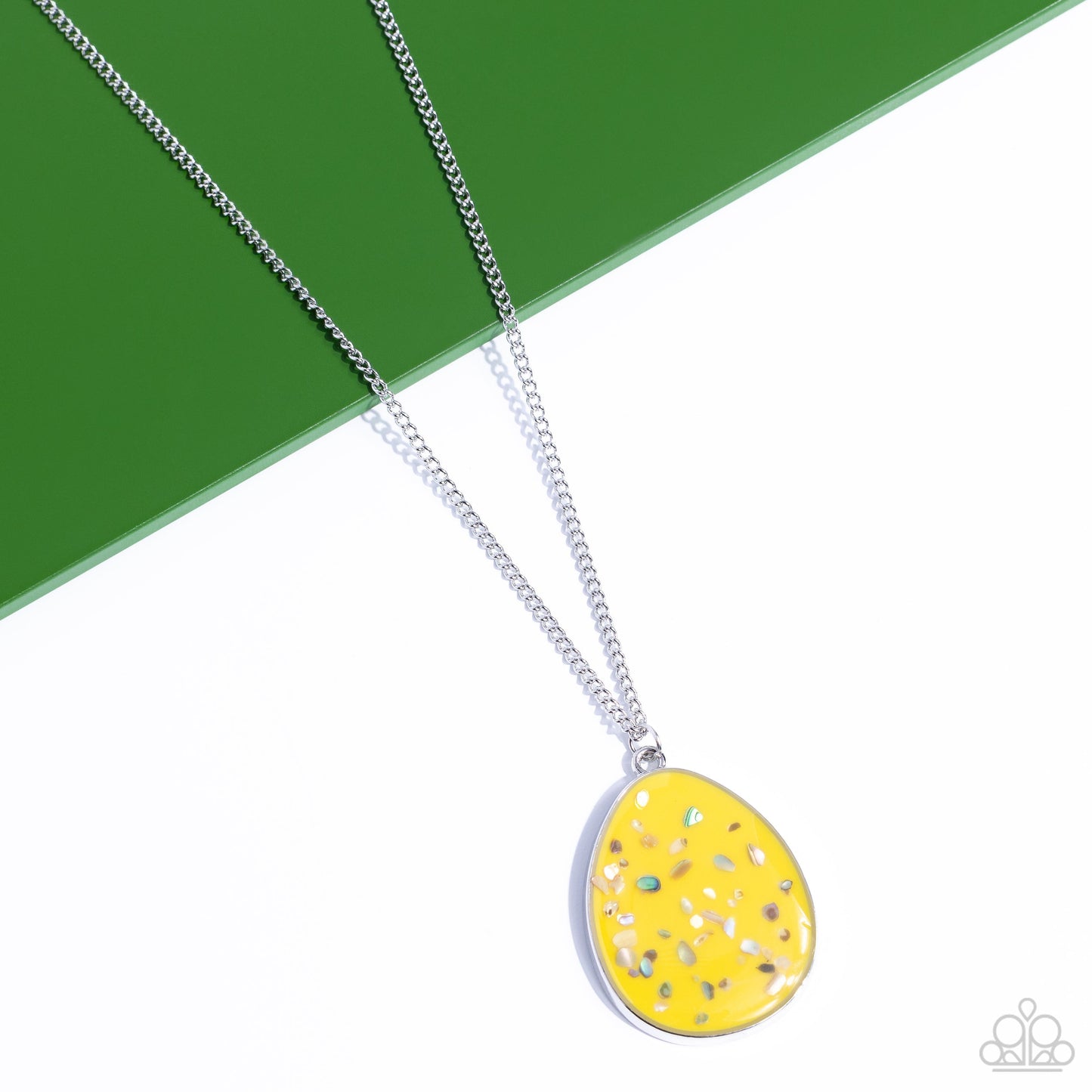 Shimmering Seafloors - Yellow and Silver Necklace - Paparazzi Accessories - Featuring a shell-like iridescence, shimmery flecks are sprinkled along a mustard yellow backdrop inside of a glassy casing. The colorful teardrop swings from the bottom of an extended silver chain, creating a summery pendant.
