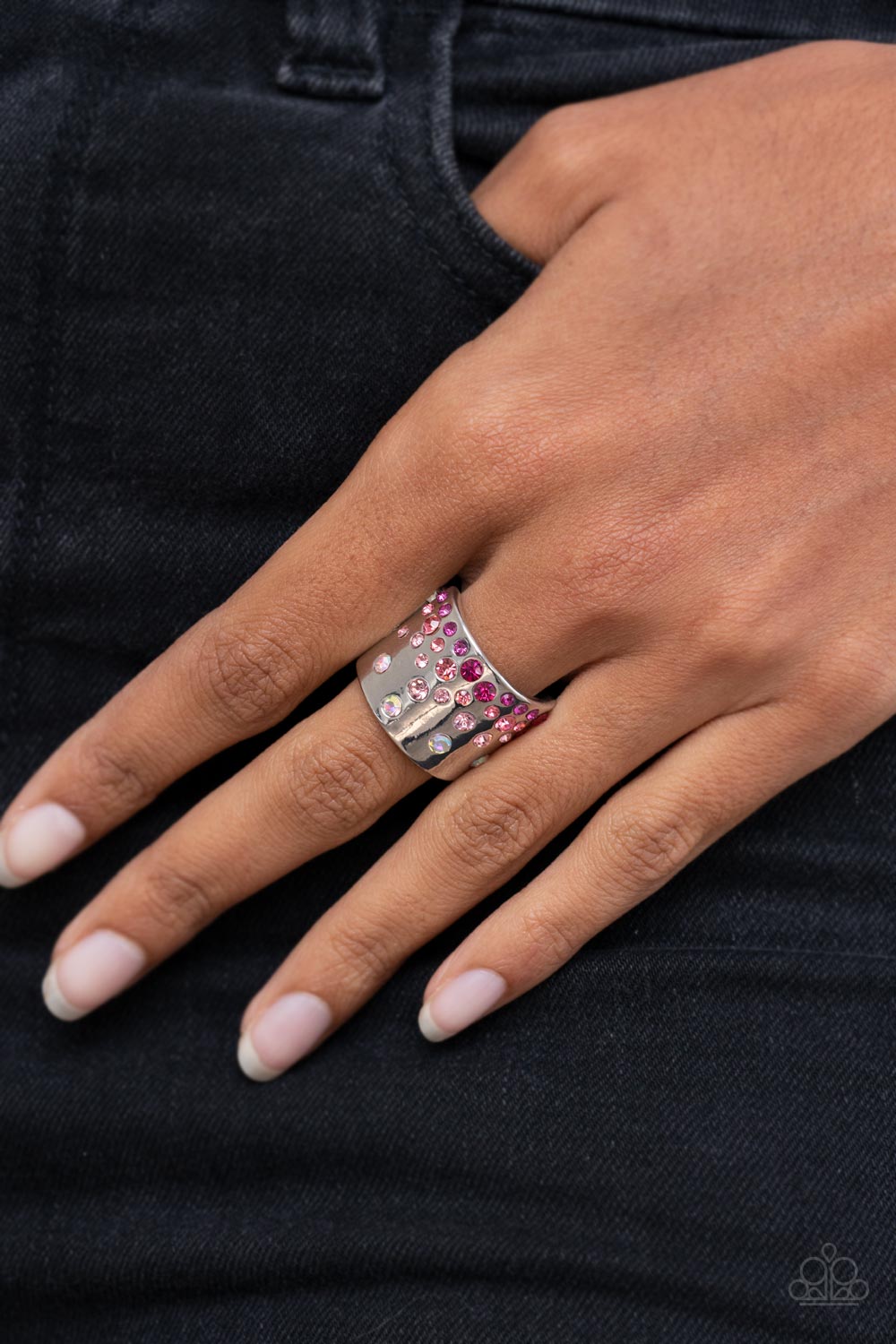 Sizzling Sultry - Iridescent Pink and Silver Fashion Ring - Paparazzi Accessories - Iridescent and glassy finishes, glitzy rows of pink and multicolored rhinestones are haphazardly sprinkled across the front of a thick silver band for a colorful splash of ombre sparkle. Features a stretchy band for a flexible fit. - Bejeweled Accessories By Kristie - Trendy fashion jewelry for everyone -