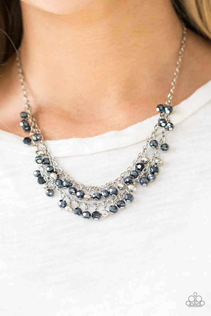 So In Season - Blue Metallic - Silver Necklace - Paparazzi Accessories - Metallic blue gems and faceted silver beads dangle from two rows of silver chains, creating a glamorous fringe below the collar. Features an adjustable clasp closure. - Bejeweled Accessories By Kristie - Trendy fashion jewelry for everyone -