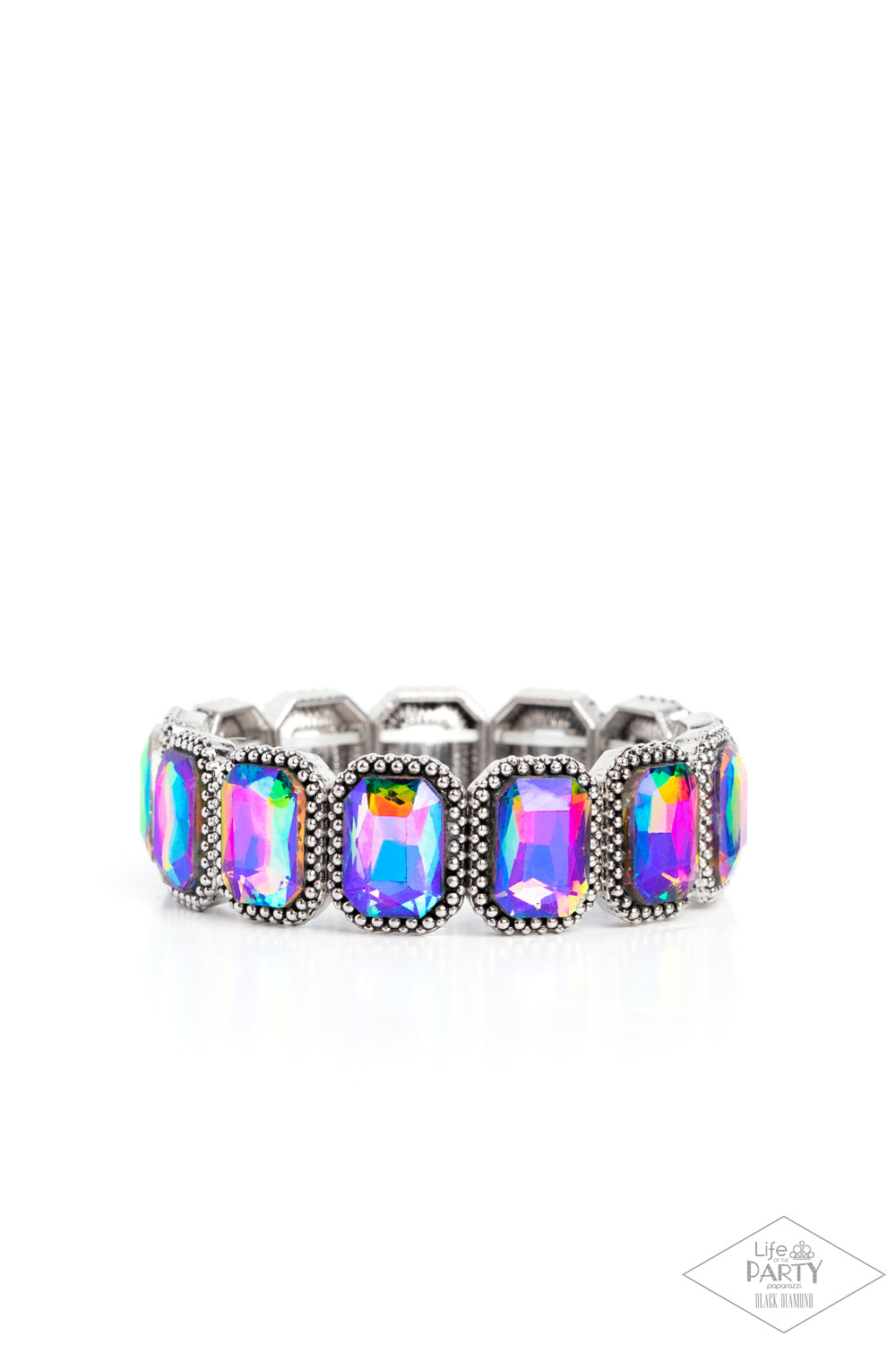 Studded Smolder - Multi Color - Oil Spill Bracelet - Paparazzi Accessories - Oversized emerald style oil spill gems are encased in antiqued studded frames that are threaded along stretchy bands around the wrist, creating a smoldering centerpiece bracelet.
