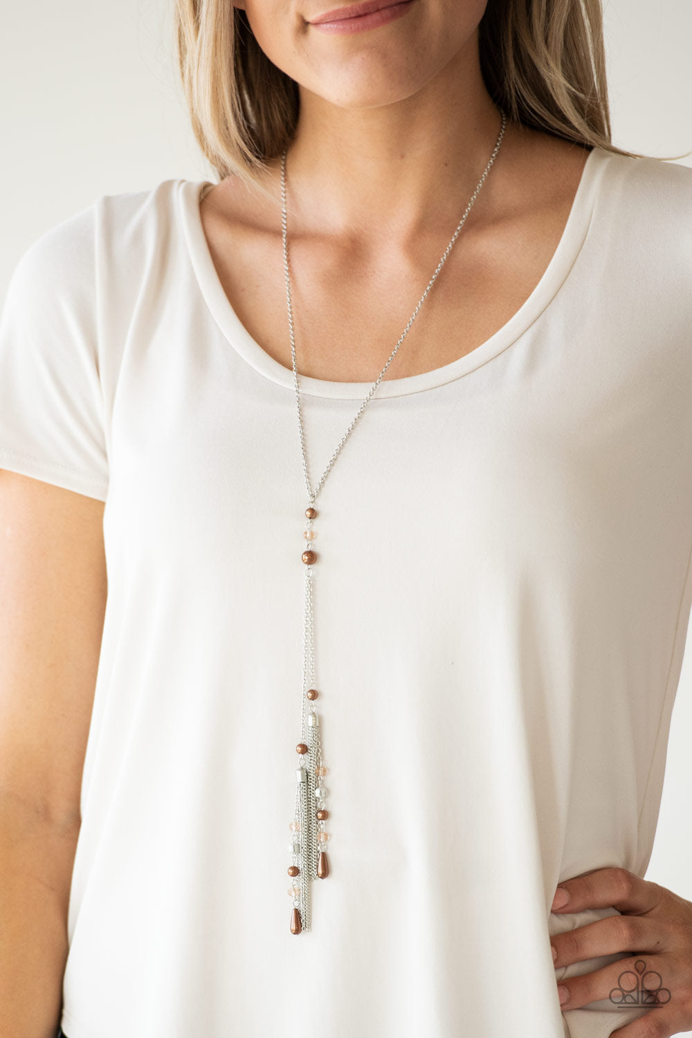 Timeless Tassels - Brown Pearl and Silver Necklace - Paparazzi Accessories - Dainty brown pearls and sparkling brown crystal-like beads give way to two shimmery silver chain tassels. Infused with ornate silver beads, strands of matching beads trickle down the tassels for a refined flair. Features an adjustable clasp closure.