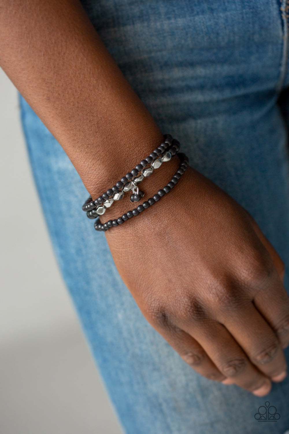 Tour de Tranquility - Black Stretchy Bracelets - Paparazzi Accessories - A collection of black stone beads and faceted silver beads are threaded along stretchy bands around the wrist, creating earthy layers. Sold as one set of three bracelets.