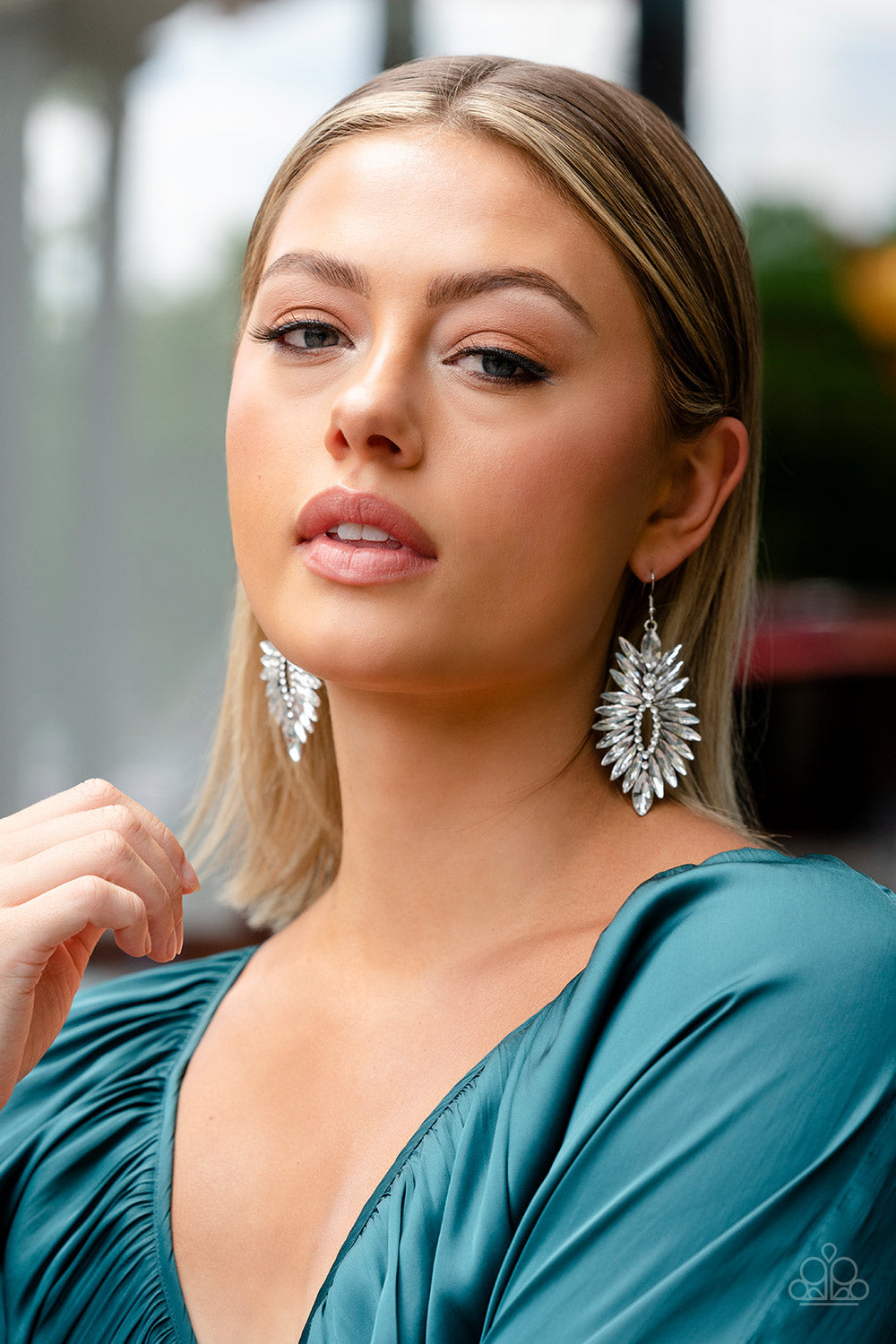 Turn up the Luxe - White Icy and Silver Earrings - Paparazzi Accessories - An explosion of white marquise rhinestones flares out from a ring of dainty white rhinestones, coalescing into an irresistibly icy statement piece. Earring attaches to a standard fishhook fitting. Sold as one pair of earrings.