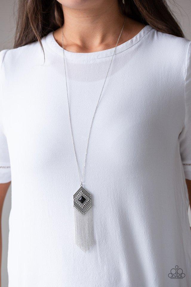 Work The ROAM - Black and Silver Necklace - Paparazzi Accessories - A square black bead is pressed into the center of a silver geometric pendant radiating with studded detail. A shimmery silver fringe swings from the bottom of the tribal inspired frame for a wanderlust fashion necklace.
