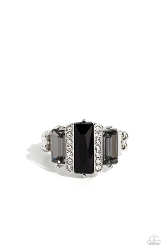 A Glitzy Verdict - Black and Silver Ring - Paparazzi Accessories - Bordered by two rows of dainty white rhinestones, an emerald cut black rhinestone adorns the center of a band dotted with a pair of smoky emerald cut rhinestones, resulting into a jaw-dropping dazzle across the finger. Features a stretchy band for a flexible fit. Sold as one individual ring. 