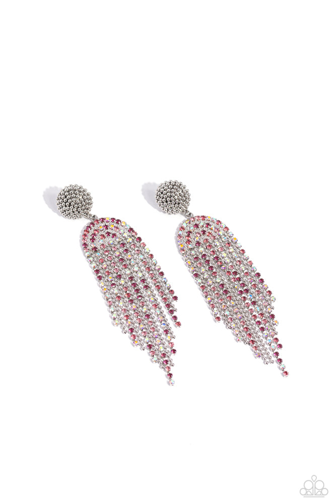 A Toast To You - Pink Iridescent Earrings - Paparazzi Accessories - Strands of various glassy pink and iridescent rhinestones and dainty silver ball chains stream from a rhinestone-encrusted arched fitting, creating a timelessly tapered fringe. Silver ball chain seemingly wraps around the post in an infinite manner above the arched fitting, creating additional tactile detail. Earring attaches to a standard post fitting.