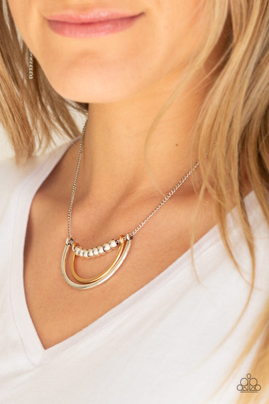 Artificial Arches - Silver Necklace - Paparazzi Accessories - A strand of shiny silver beads give way to bowing gold and silver frames, creating an edgy pendant below the collar.